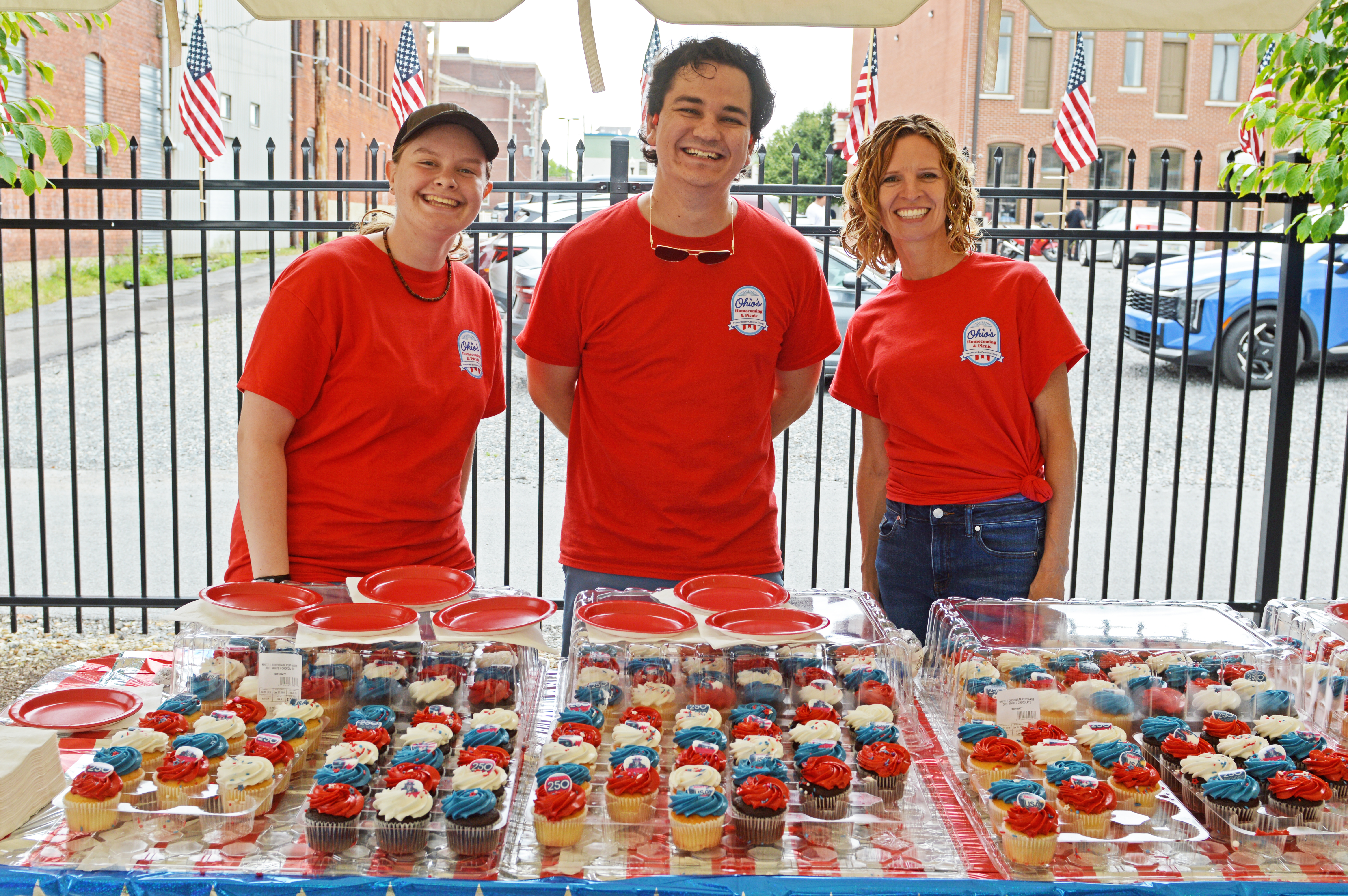 Merideth Knapp, Ben Kerber and Stacy Knapp handed out cupcakes at the Lima picnic.