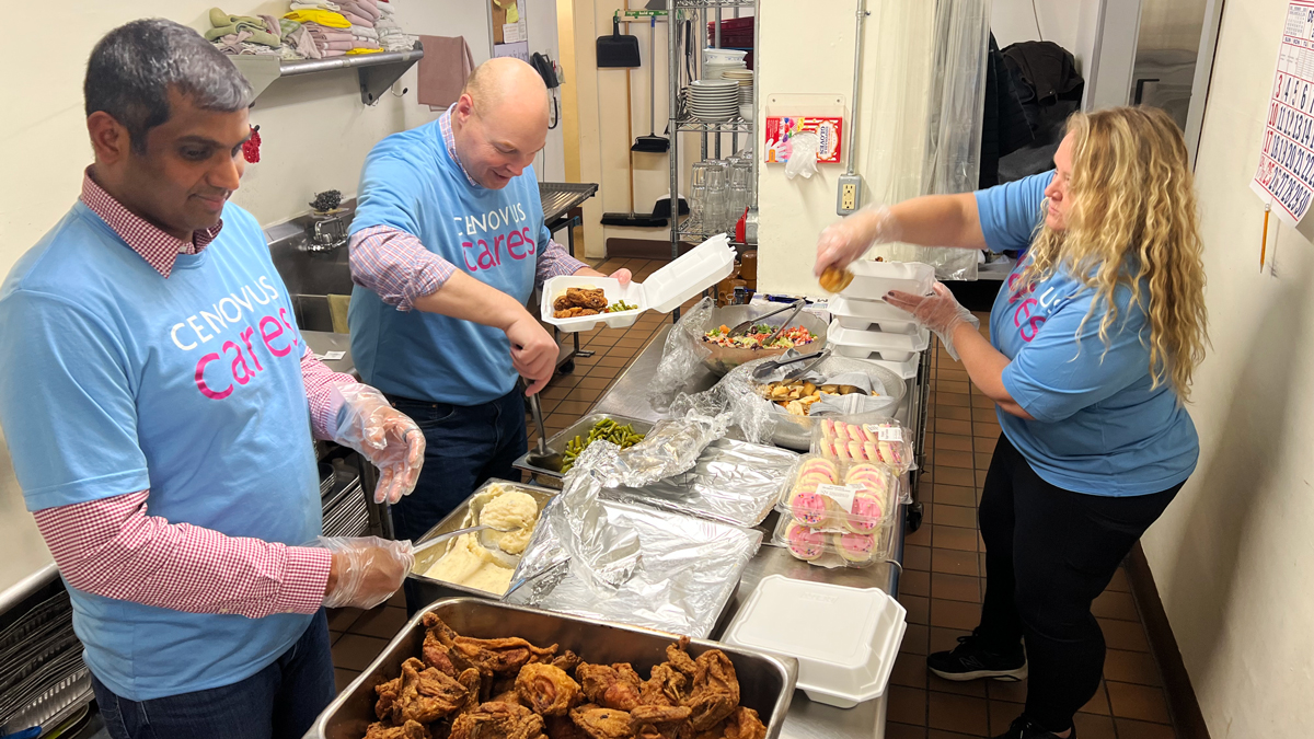 Rajeev Naroor, Chet Bowman and Shannon Wurster serve meals for the Lima Rescue Mission in Ohio.