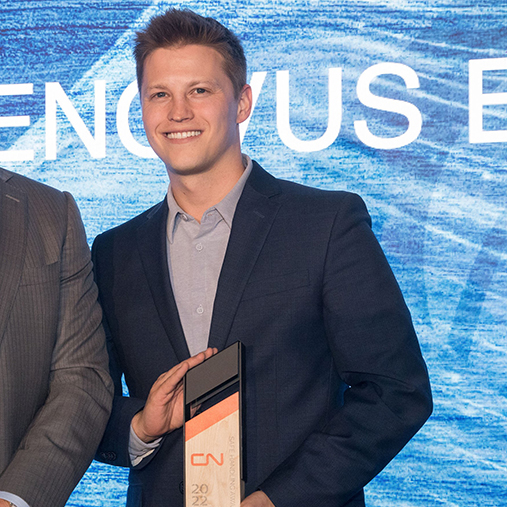 Now: Nic in 2023 accepting an industry safety award on behalf of Cenovus.