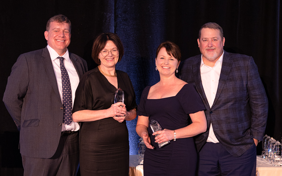Lesley Desjardins and Megan McVey accepting their President's Award.