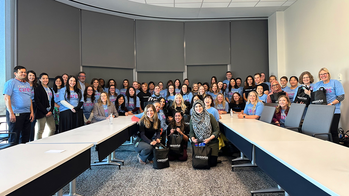 Members of the Stronger Together with Women@Cenovus network, with bags of essential items for women in need in Calgary.